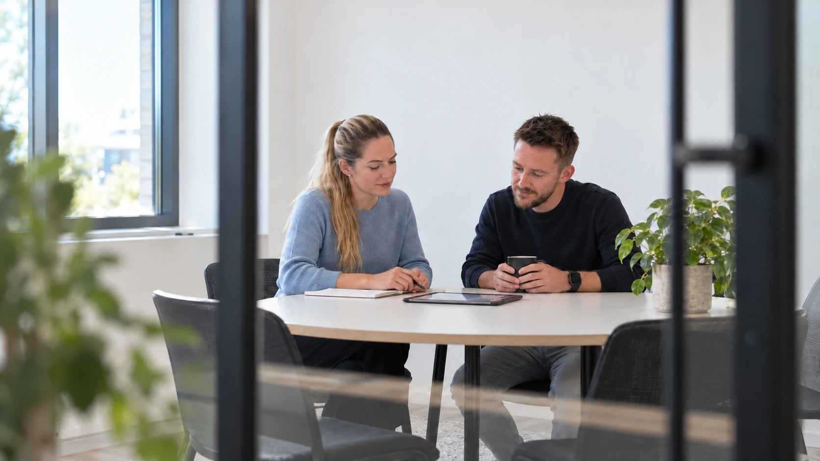 Ben and Sanne talking at a meeting table — generated visualisation